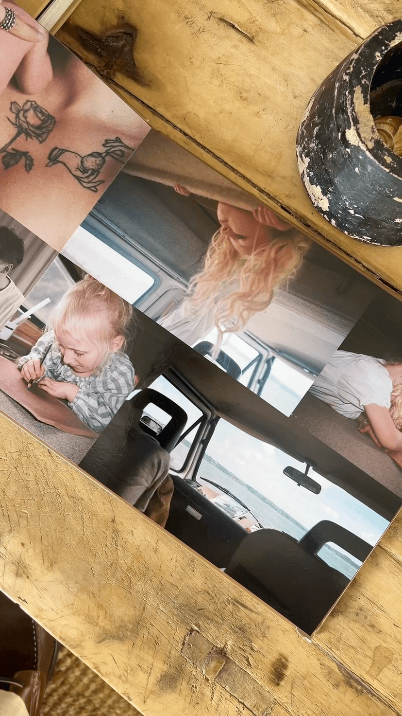 Collage of family photos on a wooden surface, featuring a child drawing, a young girl with curly hair, and car interior views.