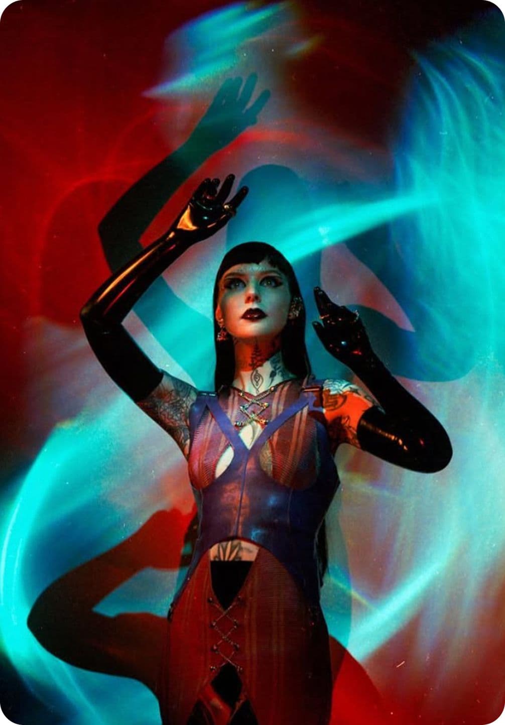 A person in futuristic attire poses with arms raised against a colorful, swirling background of red and blue light.