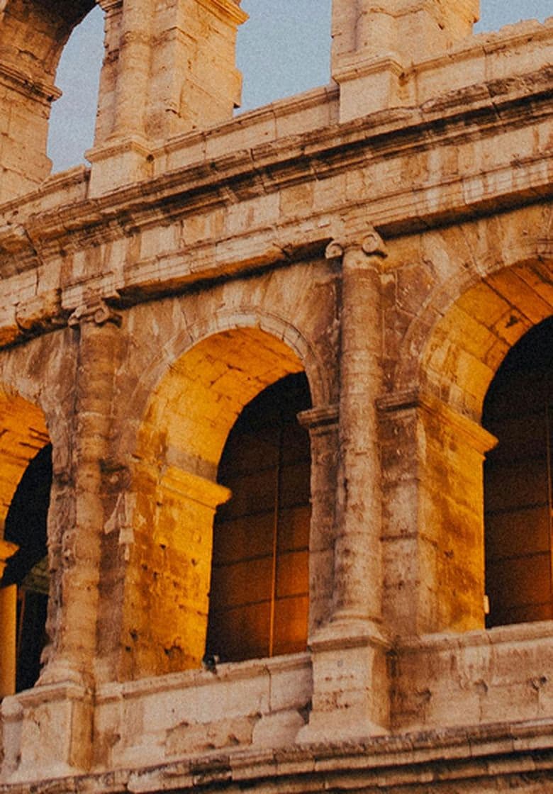 The Roman Colosseum with a dark grey sky behind it