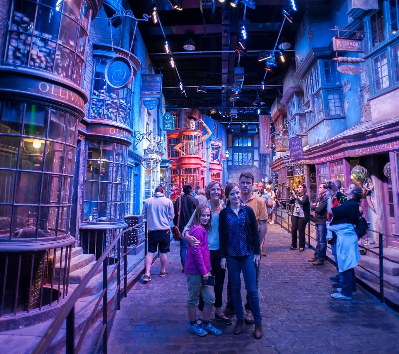 A family posing on a makeshift street inside Harry Potter Studios, Watford, UK