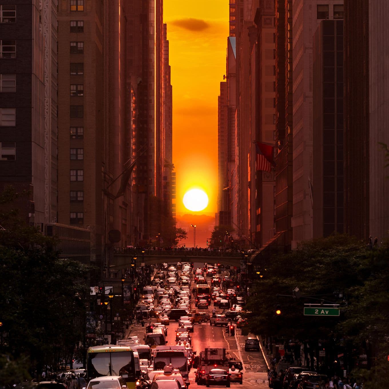 The sun setting in Manhatten, perfectly aligning between the buildings of New York City