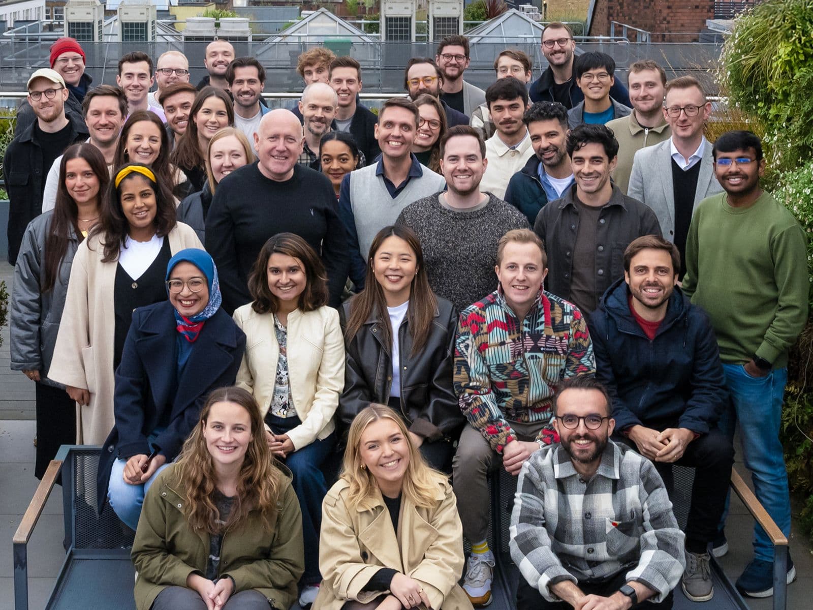 The Popsa team pose on the roof of their Soho office