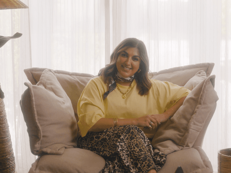 Mother of triplets Natasha Sidhu sat on an armchair
