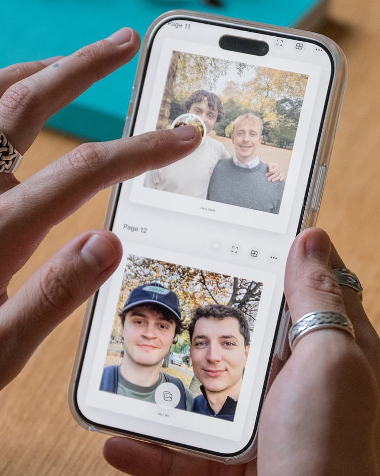 Person scrolling through photos on a smartphone, featuring two different pairs of people posing outdoors.