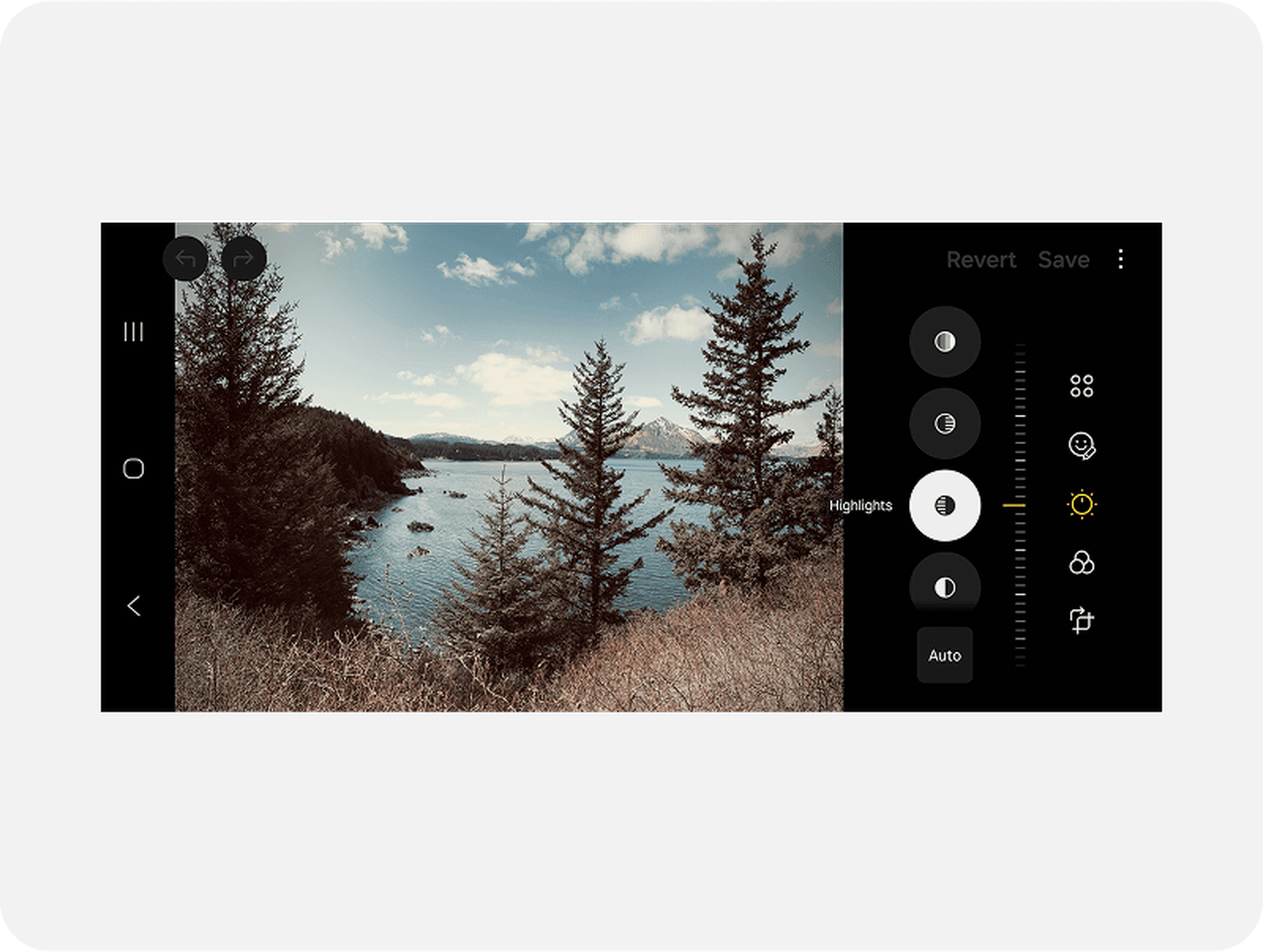 Photo editing interface showing a scenic view of a lake surrounded by trees, with mountains in the background under a partly cloudy sky.