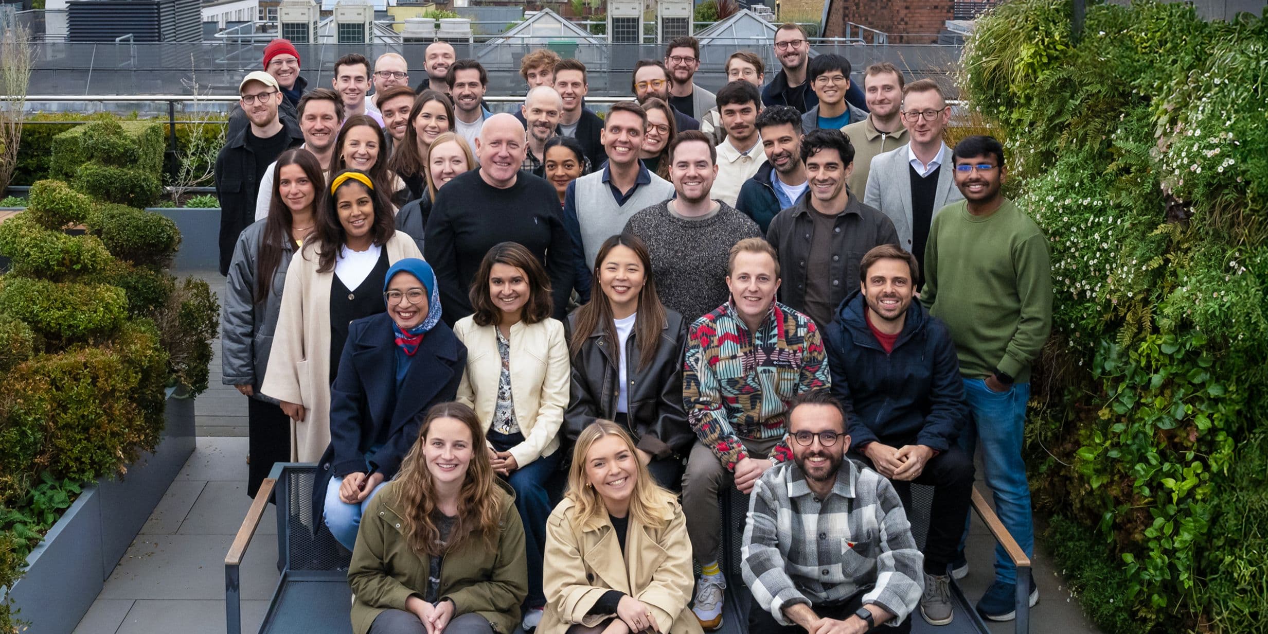 The Popsa team pose on the roof of their Soho office