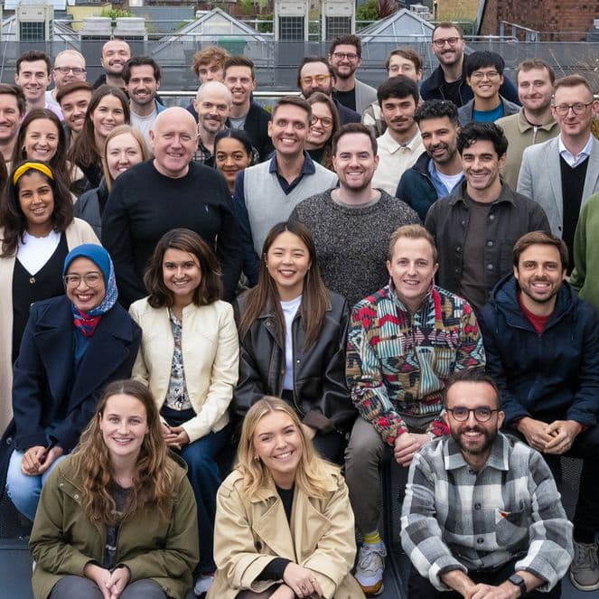 The Popsa team pose on the roof of their Soho office