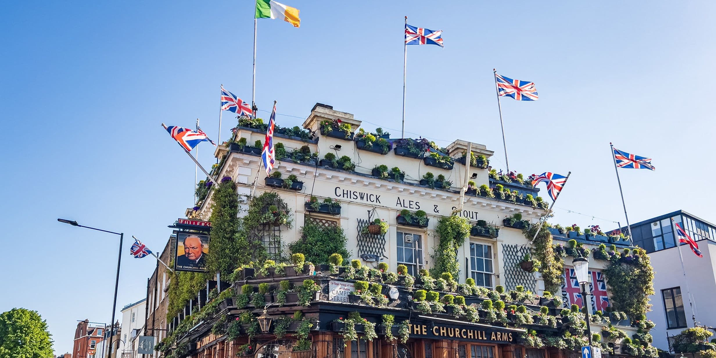 Union Jack flags decorate the roof of the Churchill Arms pub in Kensington