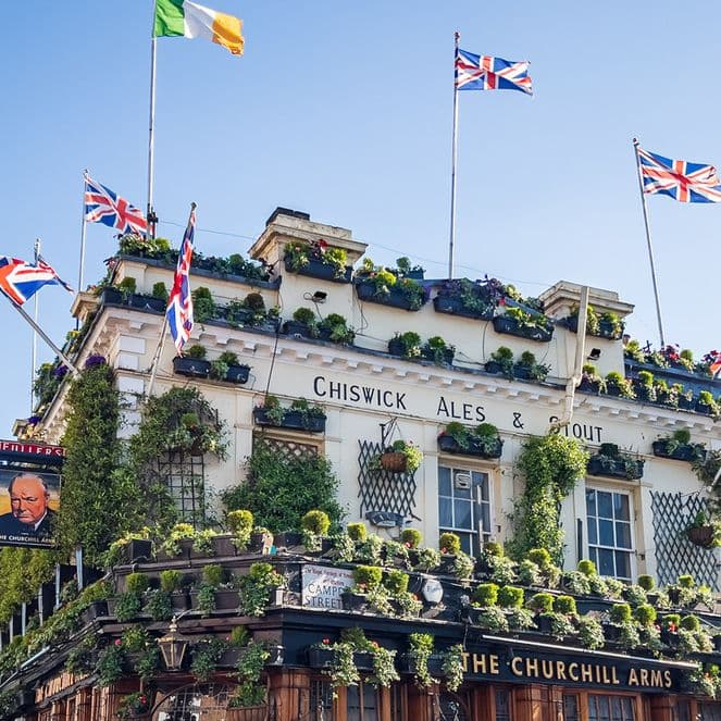 Union Jack flags decorate the roof of the Churchill Arms pub in Kensington