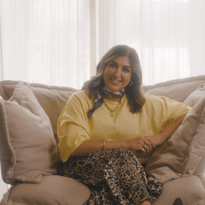 Mother of triplets Natasha Sidhu sat on an armchair