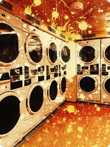 A row of white washing machines and dryers in a laundromat with a grungy, splattered overlay effect in warm tones.