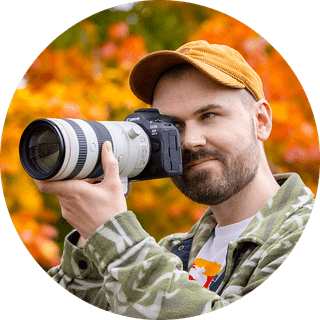 Photographer and writer Dan Mold looking through a camera