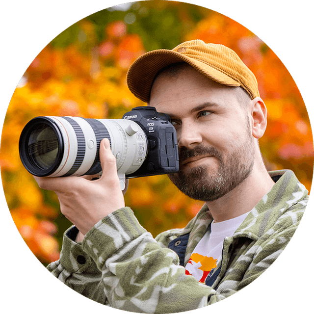 Photographer and writer Dan Mold looking through a camera