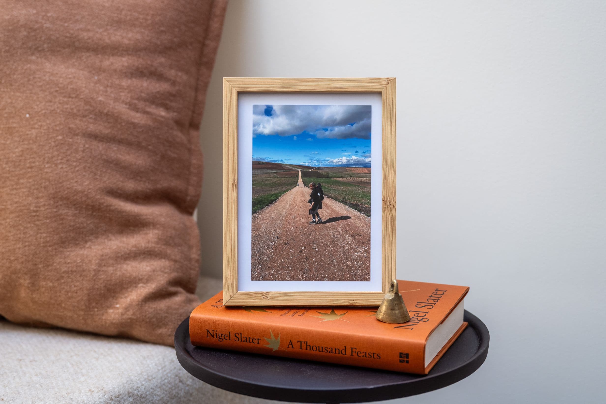 A framed bedside photo of writer Laurence Millar hiking in Camino de Santiago