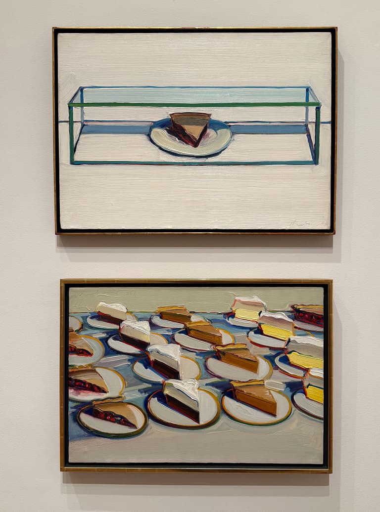 Two paintings: Top shows a single pie slice in a glass box; bottom depicts multiple pie slices on plates, arranged in a grid pattern.